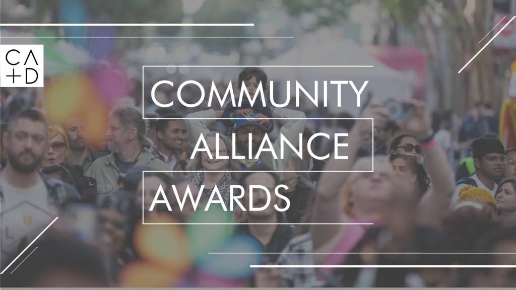 A large, diverse crowd gathers outdoors for the Community Alliance Awards. The Center for Architecture + Design logo appears on the left, with the event name in bold white text and people in colorful clothing visible in the background.